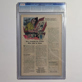 Comic book page with a man drawing, framed in a protective case.