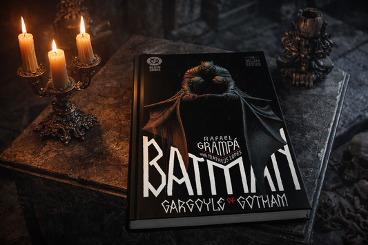 Batman: Gargoyle of Gotham Hardcover Graphic Novel resting on a gothic style coffee table